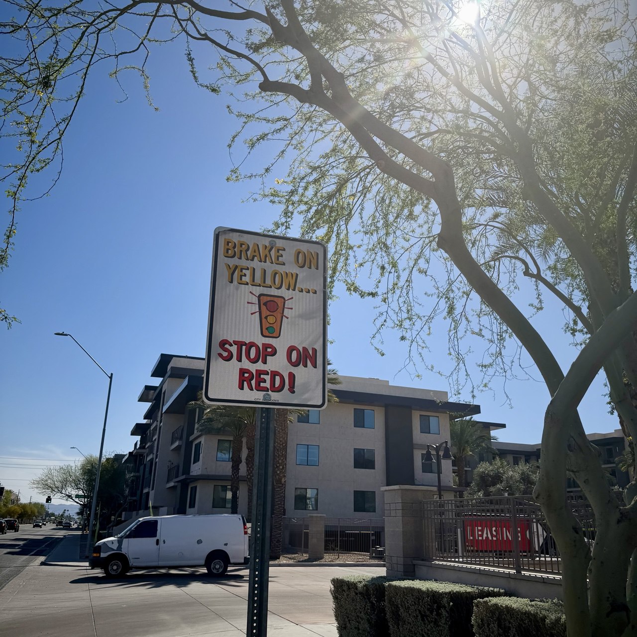 Street sign that says brake on yellow, stop on red!